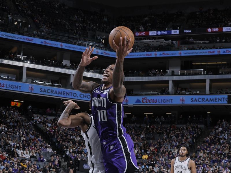 SACRAMENTO, CA - NOVEMBER 24: DeMar DeRozan #10 of the Sacramento Kings drives to the basket during the game against the Brooklyn Nets on November 24, 2024 at Golden 1 Center in Sacramento, California. NOTE TO USER: User expressly acknowledges and agrees that, by downloading and or using this Photograph, user is consenting to the terms and conditions of the Getty Images License Agreement. Mandatory Copyright Notice: Copyright 2024 NBAE (Photo by Rocky Widner/NBAE via Getty Images)