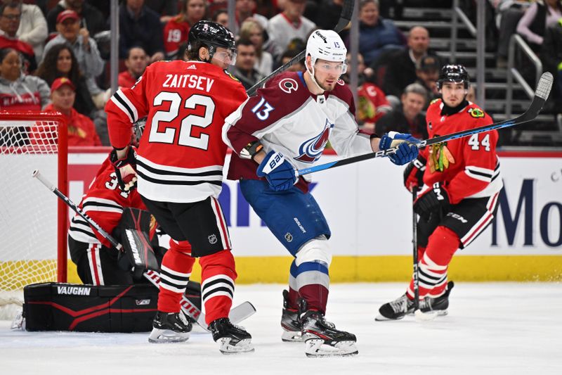 Dec 19, 2023; Chicago, Illinois, USA; Colorado Avalanche forward Valeri Nichushkin (13) battles for position in front of the net with Chicago Blackhawks defenseman Nikita Zaitsev (22) in the second period at United Center. Mandatory Credit: Jamie Sabau-USA TODAY Sports