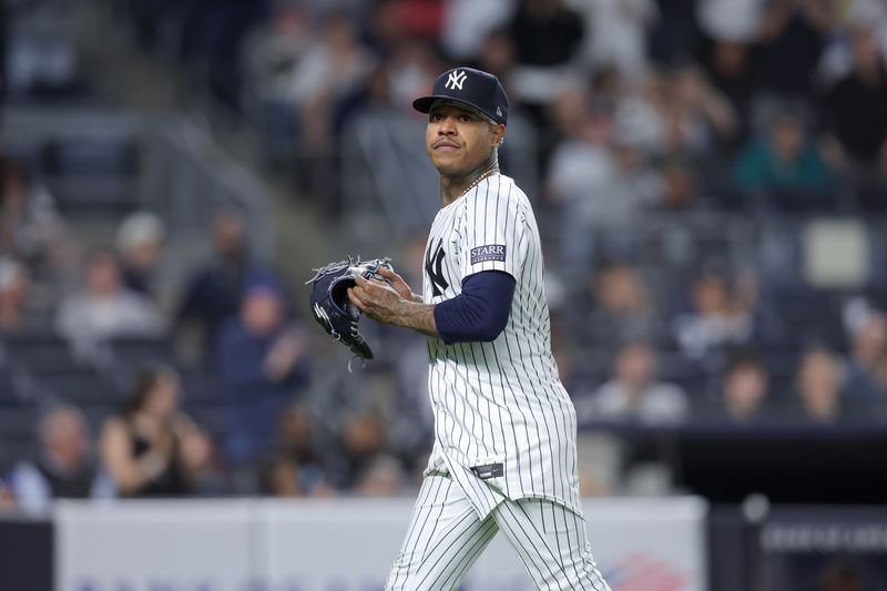 May 20, 2024; Bronx, New York, USA; New York Yankees starting pitcher Marcus Stroman (0) reacts as he walks off the field after being taken out of the game against the Seattle Mariners during the eighth inning at Yankee Stadium. Mandatory Credit: Brad Penner-USA TODAY Sports