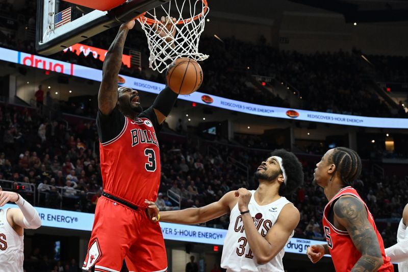 CLEVELAND, OHIO - JANUARY 15: Andre Drummond #3 of the Chicago Bulls dunks against Jarrett Allen #31 of the Cleveland Cavaliers during the second half at Rocket Mortgage Fieldhouse on January 15, 2024 in Cleveland, Ohio. NOTE TO USER: User expressly acknowledges and agrees that, by downloading and or using this photograph, User is consenting to the terms and conditions of the Getty Images License Agreement. (Photo by Nick Cammett/Getty Images)