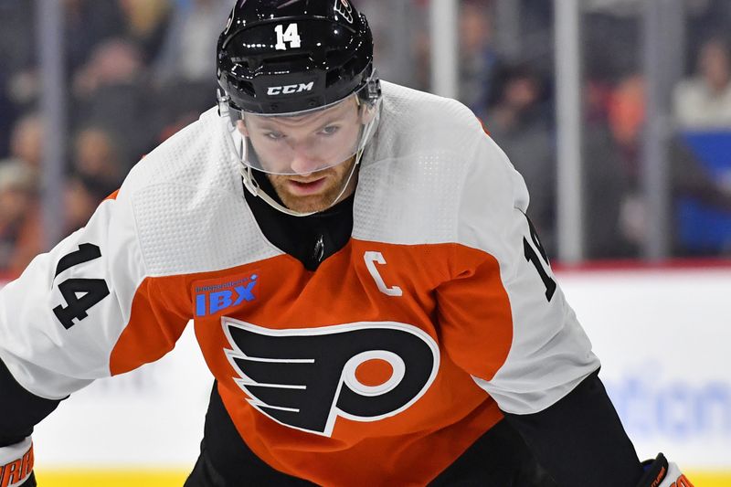 Feb 27, 2024; Philadelphia, Pennsylvania, USA; Philadelphia Flyers center Sean Couturier (14) against the Tampa Bay Lightning during the first period at Wells Fargo Center. Mandatory Credit: Eric Hartline-USA TODAY Sports