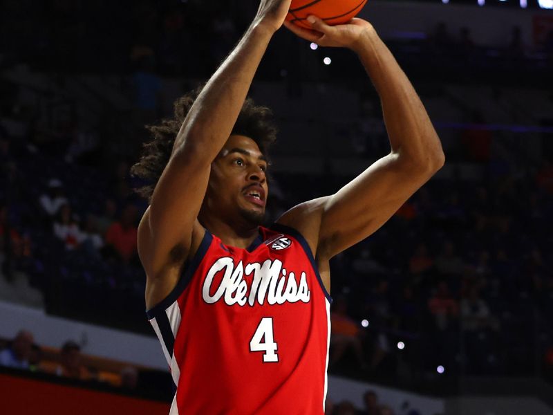 Feb 15, 2023; Gainesville, Florida, USA; Mississippi Rebels forward Jaemyn Brakefield (4) makes a three point basket against the Florida Gators during the first half at Exactech Arena at the Stephen C. O'Connell Center. Mandatory Credit: Kim Klement-USA TODAY Sports