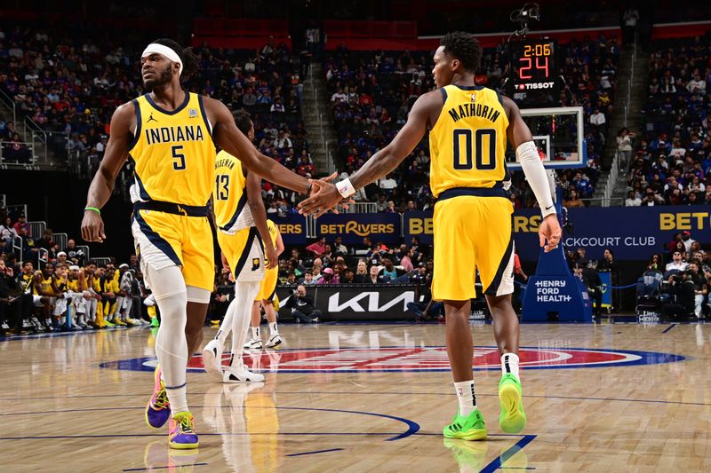 DETROIT, MI - OCTOBER 23: Jarace Walker #5 and Bennedict Mathurin #00 of the Indiana Pacers high five during the game against the Detroit Pistons on October 23, 2024 at Little Caesars Arena in Detroit, Michigan. NOTE TO USER: User expressly acknowledges and agrees that, by downloading and/or using this photograph, User is consenting to the terms and conditions of the Getty Images License Agreement. Mandatory Copyright Notice: Copyright 2024 NBAE (Photo by Chris Schwegler/NBAE via Getty Images)