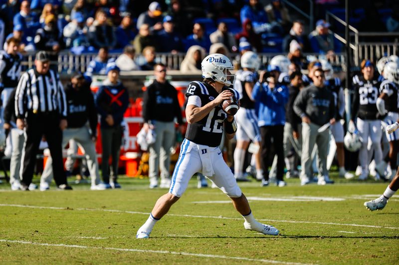 Nov 25, 2023; Durham, North Carolina, USA; Duke Blue Devils quarterback Grayson Loftis (12) prepares to throw the football during the first half of the game against Pittsburgh Panthers at Wallace Wade Stadium. Mandatory Credit: Jaylynn Nash-USA TODAY Sports