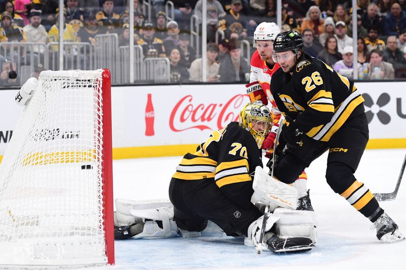 Jan 8, 2026; Boston, Massachusetts, USA; Calgary Flames center Connor Zary (47) scores a goal past Boston Bruins goaltender Joonas Korpisalo (70) during the second period at TD Garden. Mandatory Credit: Bob DeChiara-Imagn Images