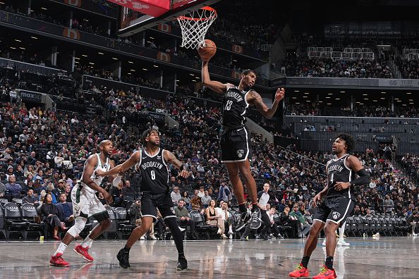 BROOKLYN, NY - DECEMBER 27: Armoni Brooks #13 of the Brooklyn Nets grabs a rebound during the game against the Milwaukee Bucks on December 27, 2023 at Barclays Center in Brooklyn, New York. NOTE TO USER: User expressly acknowledges and agrees that, by downloading and or using this Photograph, user is consenting to the terms and conditions of the Getty Images License Agreement. Mandatory Copyright Notice: Copyright 2023 NBAE (Photo by Jesse D. Garrabrant/NBAE via Getty Images)