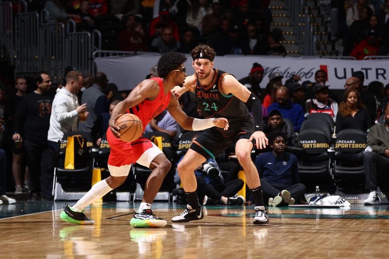 WASHINGTON, DC -? APRIL 5:  Corey Kispert #24 of the Washington Wizards plays defense during the game against the Portland Trail Blazers on April 5, 2024 at Capital One Arena in Washington, DC. NOTE TO USER: User expressly acknowledges and agrees that, by downloading and or using this Photograph, user is consenting to the terms and conditions of the Getty Images License Agreement. Mandatory Copyright Notice: Copyright 2024 NBAE (Photo by Kenny Giarla/NBAE via Getty Images)