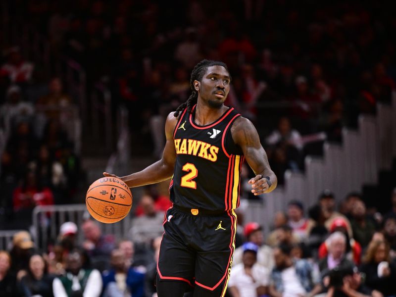 ATLANTA, GA - NOVEMBER 15:  Keaton Wallace #2 of the Atlanta Hawks dribbles the ball during the game against the Washington Wizards during the Emirates NBA Cup game on November 15, 2024 at State Farm Arena in Atlanta, Georgia.  NOTE TO USER: User expressly acknowledges and agrees that, by downloading and/or using this Photograph, user is consenting to the terms and conditions of the Getty Images License Agreement. Mandatory Copyright Notice: Copyright 2024 NBAE (Photo by Adam Hagy/NBAE via Getty Images)