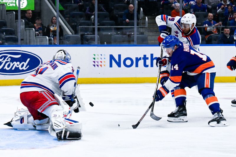 Feb 25, 2025; Elmont, New York, USA;  New York Rangers goaltender Igor Shesterkin (31) makes a save against New York Islanders center Bo Horvat (14) defended by New York Rangers defenseman K'Andre Miller (79) during the second period at UBS Arena. Mandatory Credit: Dennis Schneidler-Imagn Images