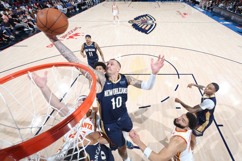 CHICAGO, IL - NOVEMBER 3: Daniel Theis #10 of the New Orleans Pelicans rebounds the ball during the game against the Atlanta Hawks on November 3, 2024 at United Center in Chicago, Illinois. NOTE TO USER: User expressly acknowledges and agrees that, by downloading and or using this photograph, User is consenting to the terms and conditions of the Getty Images License Agreement. Mandatory Copyright Notice: Copyright 2024 NBAE (Photo by Jeff Haynes/NBAE via Getty Images)