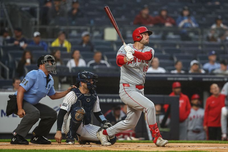 Aug 8, 2024; Bronx, New York, USA;  Los Angeles Angels first baseman Nolan Schanuel (18) hits a solo home run in the first inning against the New York Yankees at Yankee Stadium. Mandatory Credit: Wendell Cruz-USA TODAY Sports