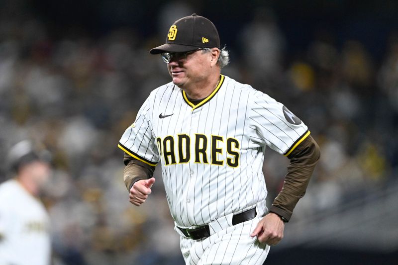 May 14, 2025; San Diego, California, USA; San Diego Padres manager Mike Shildt (8) runs off the field during the eighth inning against the Los Angeles Angels at Petco Park. Mandatory Credit: Denis Poroy-Imagn Images