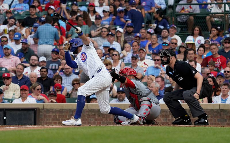 Aug 4, 2024; Chicago, Illinois, USA; Chicago Cubs shortstop Dansby Swanson (7) hits a single against the St. Louis Cardinals during the second inning at Wrigley Field. Mandatory Credit: David Banks-USA TODAY Sports