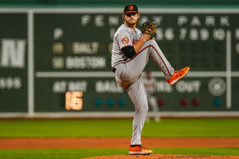 Apr 10, 2024; Boston, Massachusetts, USA; Baltimore Orioles pitcher Cole Irvin (19) throws a pitch against the Boston Red Sox in the first inning at Fenway Park. Mandatory Credit: David Butler II-USA TODAY Sports