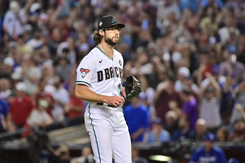 Nov 1, 2023; Phoenix, AZ, USA; Arizona Diamondbacks starting pitcher Zac Gallen (23) returns to the dugout in the sixth inning against the Texas Rangers in game five of the 2023 World Series at Chase Field. Mandatory Credit: Matt Kartozian-USA TODAY Sports