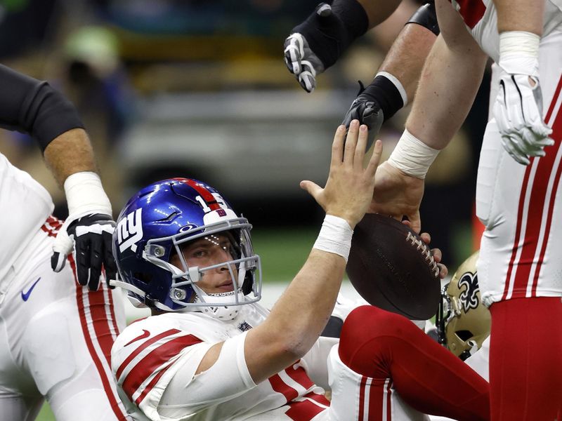 New York Giants quarterback Tommy DeVito (15) during an NFL football game against the New Orleans Saints, Sunday, Dec. 17, 2023, in New Orleans. (AP Photo/Tyler Kaufman)