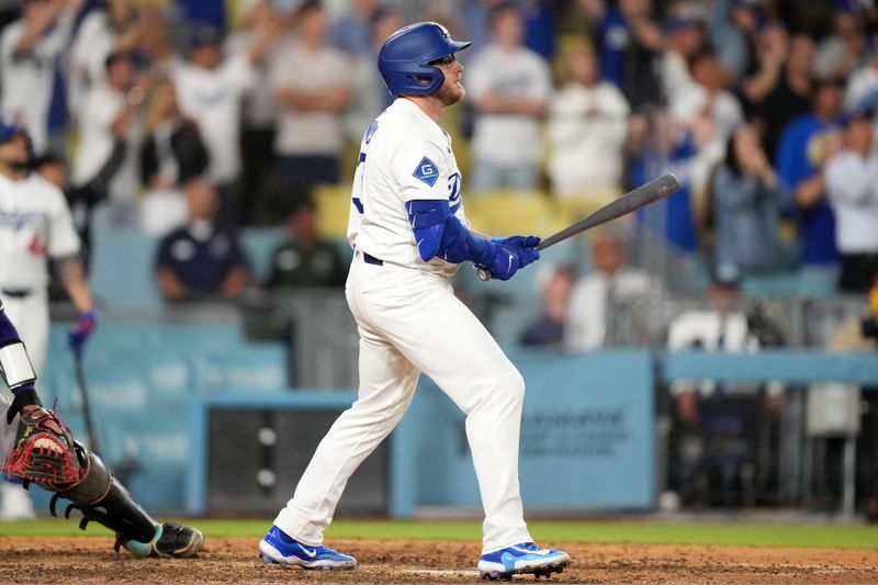 May 20, 2025; Los Angeles, California, USA; Los Angeles Dodgers third baseman Max Muncy (13) hits a walk-off sacrifice fly in the 10th inning against the Arizona Diamondbacks at Dodger Stadium. Mandatory Credit: Kirby Lee-Imagn Images