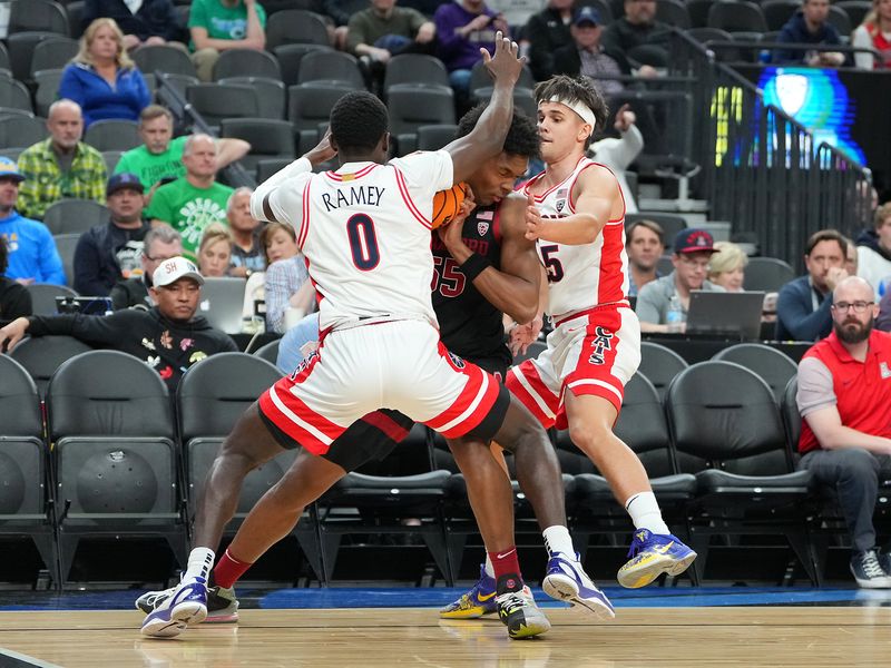 Mar 9, 2023; Las Vegas, NV, USA; Stanford Cardinal forward Harrison Ingram (55) is defended by Arizona Wildcats guards Courtney Ramey (0) and Kerr Kriisa (25) during the first half at T-Mobile Arena. Mandatory Credit: Stephen R. Sylvanie-USA TODAY Sports