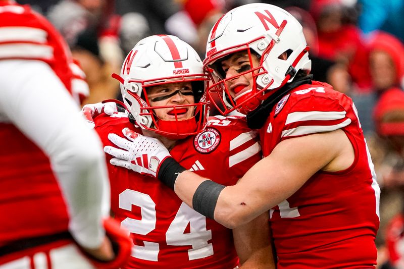 Oct 28, 2023; Lincoln, Nebraska, USA; Nebraska Cornhuskers tight end Thomas Fidone II (24) and tight end Nate Boerkircher (87) celebrate after a touchdown by Fidone II against the Purdue Boilermakers during the second quarter at Memorial Stadium. Mandatory Credit: Dylan Widger-USA TODAY Sports