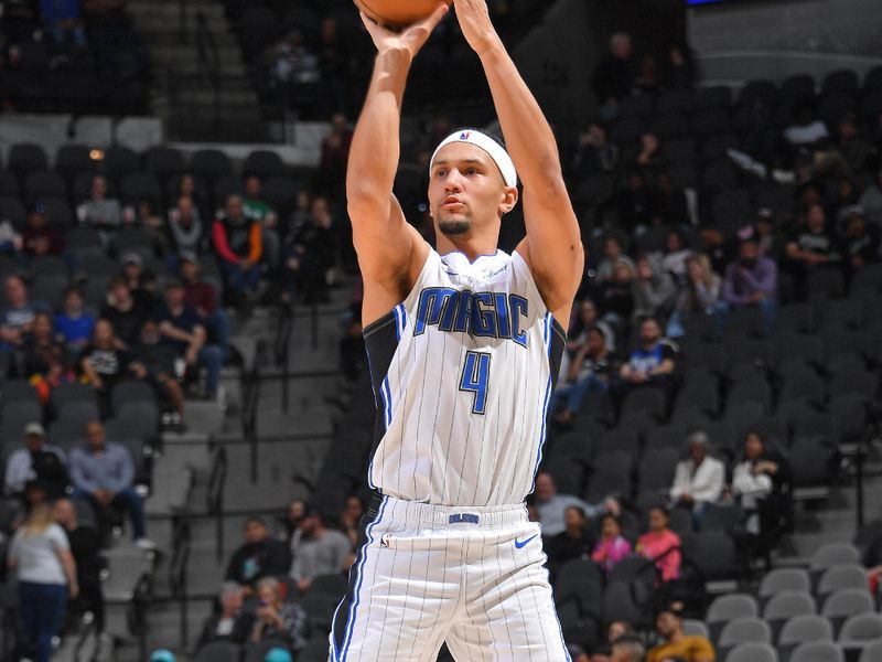 SAN ANTONIO, TX - MARCH 14: Jalen Suggs #4 of the Orlando Magic shoots the ball during the game against the San Antonio Spurs on March 14, 2023 at the AT&T Center in San Antonio, Texas. NOTE TO USER: User expressly acknowledges and agrees that, by downloading and or using this photograph, user is consenting to the terms and conditions of the Getty Images License Agreement. Mandatory Copyright Notice: Copyright 2023 NBAE (Photos by Michael Gonzales/NBAE via Getty Images)