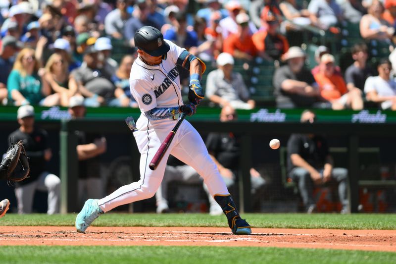 Jul 4, 2024; Seattle, Washington, USA; Seattle Mariners center fielder Julio Rodriguez (44) hits a home run against the Baltimore Orioles during the fifth inning at T-Mobile Park. Mandatory Credit: Steven Bisig-USA TODAY Sports