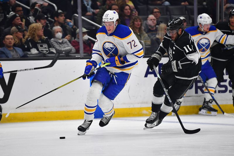 Feb 13, 2023; Los Angeles, California, USA; Buffalo Sabres center Tage Thompson (72) moves the puck ahead of Los Angeles Kings center Anze Kopitar (11) during the second period at Crypto.com Arena. Mandatory Credit: Gary A. Vasquez-USA TODAY Sports