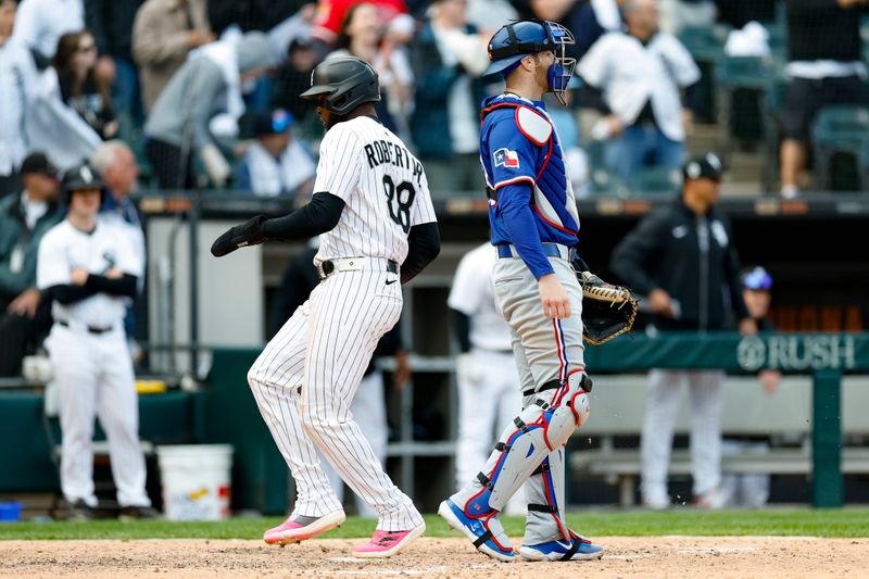 May 24, 2025; Chicago, Illinois, USA; Chicago White Sox center fielder Luis Robert Jr. (88) scores against the Texas Rangers during the sixth inning at Rate Field. Mandatory Credit: Kamil Krzaczynski-Imagn Images