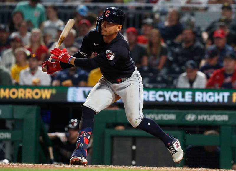 Jul 18, 2023; Pittsburgh, Pennsylvania, USA; Cleveland Guardians second baseman Andres Gimenez (0) hits a single against the Pittsburgh Pirates during the ninth inning at PNC Park. Cleveland won 10-1. Mandatory Credit: Charles LeClaire-USA TODAY Sports