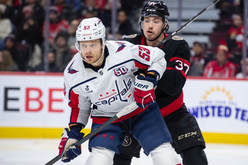 Jan 16, 2025; Ottawa, Ontario, CAN; Washington Capitals center Ethen Frank (53) and Ottawa Senators defenseman Donovan Sebrango (37) battle for position in the second period at the Canadian Tire Centre. Mandatory Credit: Marc DesRosiers-Imagn Images