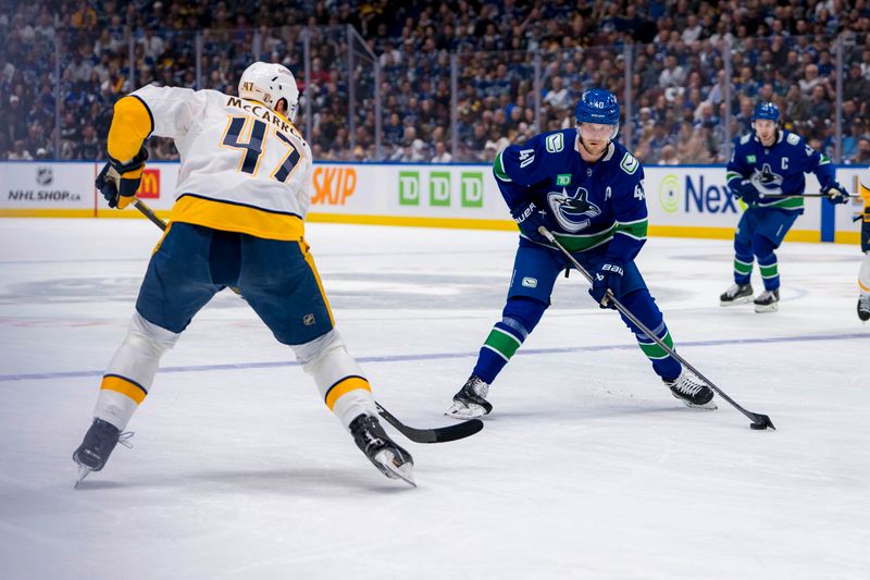 Apr 23, 2024; Vancouver, British Columbia, CAN; Vancouver Canucks forward Elias Pettersson (40) drives on Nashville Predators forward Michael McCarron (47) during the first period in game two of the first round of the 2024 Stanley Cup Playoffs at Rogers Arena. Mandatory Credit: Bob Frid-USA TODAY Sports