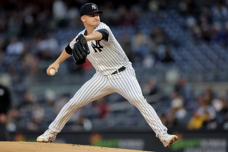 May 3, 2023; Bronx, New York, USA; New York Yankees starting pitcher Clarke Schmidt (36) pitches against the Cleveland Guardians during the first inning at Yankee Stadium. Mandatory Credit: Brad Penner-USA TODAY Sports