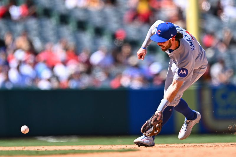 Aug 24, 2025; Anaheim, California, USA; Chicago Cubs shortstop Dansby Swanson (7) fields a ball against the Los Angeles Angels during the sixth inning at Angel Stadium. Mandatory Credit: Jonathan Hui-Imagn Images