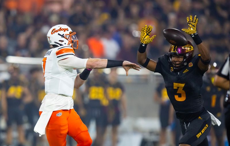 Sep 9, 2023; Tempe, Arizona, USA; Oklahoma State Cowboys quarterback Alan Bowman (7) throws a pass against Arizona State Sun Devils defensive lineman Clayton Smith (3) in the first half at Mountain America Stadium. Mandatory Credit: Mark J. Rebilas-USA TODAY Sports