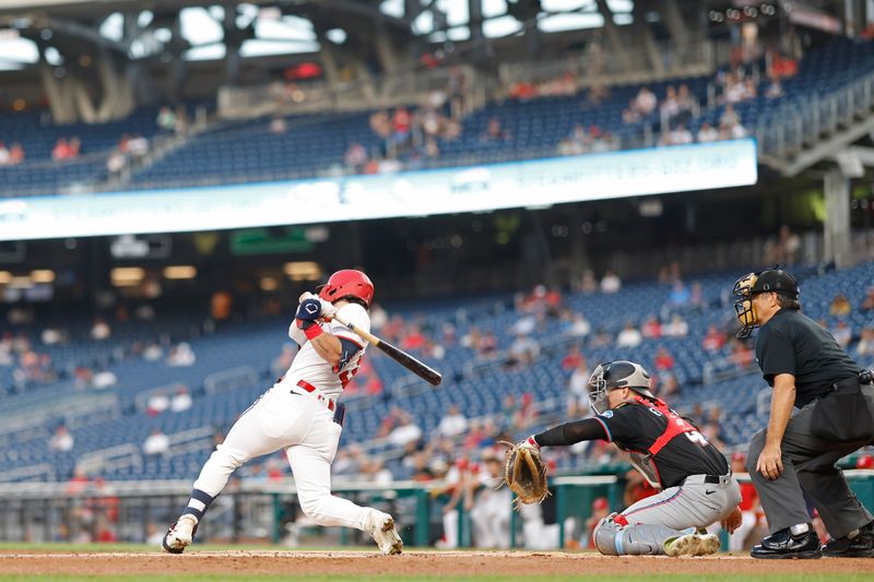 Sep 12, 2024; Washington, District of Columbia, USA; Washington Nationals outfielder Dylan Crews (3) hits an RBI single against the Miami Marlins during the first inning at Nationals Park. Mandatory Credit: Geoff Burke-Imagn Images