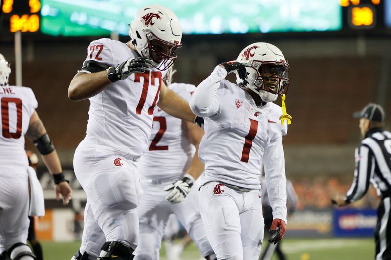 Nov 7, 2020; Corvallis, Oregon, USA; Washington State Cougars wide receiver Travell Harris (1) celebrates with teammates after scoring a touchdown agent the Oregon State Beavers during the first half at Reser Stadium. Mandatory Credit: Soobum Im-USA TODAY Sports