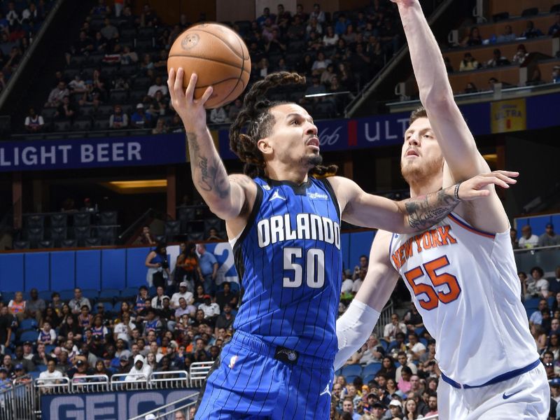 ORLANDO, FL - MARCH 23: Cole Anthony #50 of the Orlando Magic drives to the basket during the game against the New York Knicks on March 23, 2023 at Amway Center in Orlando, Florida. NOTE TO USER: User expressly acknowledges and agrees that, by downloading and or using this photograph, User is consenting to the terms and conditions of the Getty Images License Agreement. Mandatory Copyright Notice: Copyright 2023 NBAE (Photo by Gary Bassing/NBAE via Getty Images)