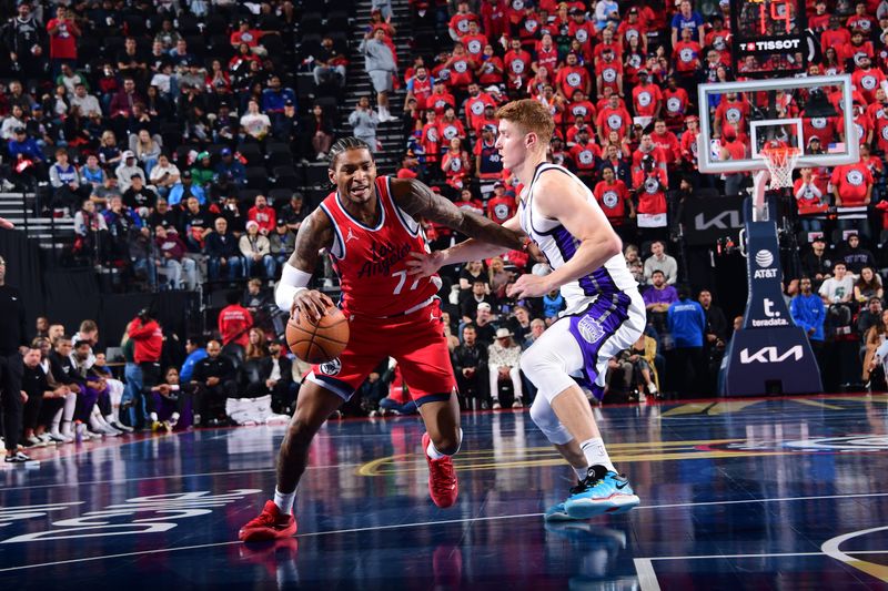 INGLEWOOD, CA - NOVEMBER 22: Kevin Porter Jr. #77 of the LA Clippers dribbles the ball during the game against the Sacramento Kings on November 22, 2024 at Intuit Dome in Los Angeles, California. NOTE TO USER: User expressly acknowledges and agrees that, by downloading and/or using this Photograph, user is consenting to the terms and conditions of the Getty Images License Agreement. Mandatory Copyright Notice: Copyright 2024 NBAE (Photo by Adam Pantozzi/NBAE via Getty Images)