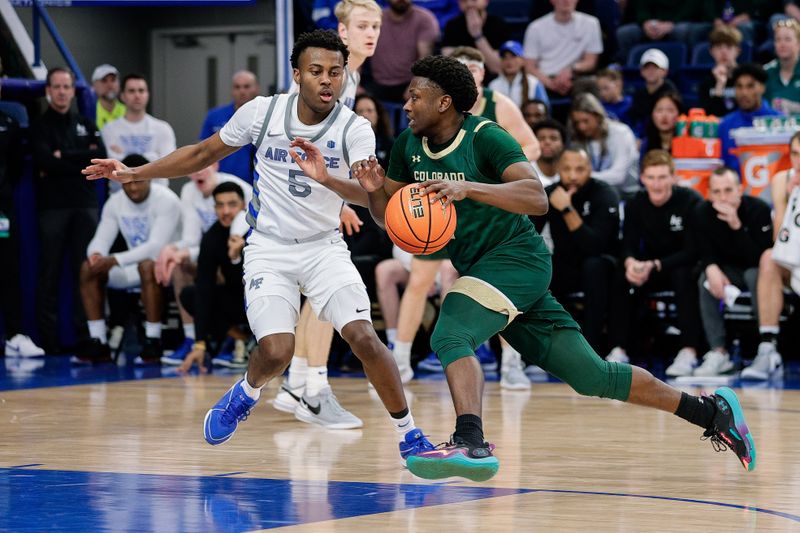 Mar 9, 2024; Colorado Springs, Colorado, USA; Colorado State Rams guard Isaiah Stevens (4) controls the ball as Air Force Falcons guard Ethan Taylor (5) guards in the first half at Clune Arena. Mandatory Credit: Isaiah J. Downing-USA TODAY Sports