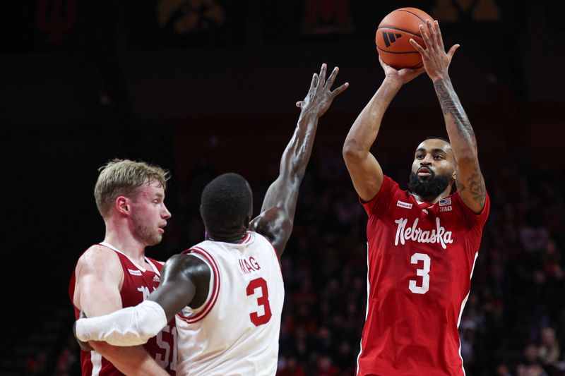 Jan 17, 2024; Piscataway, New Jersey, USA; Nebraska Cornhuskers guard Brice Williams (3) shoots the ball as forward Rienk Mast (51) screens Rutgers Scarlet Knights forward Mawot Mag (3) during the first half at Jersey Mike's Arena. Mandatory Credit: Vincent Carchietta-USA TODAY Sports