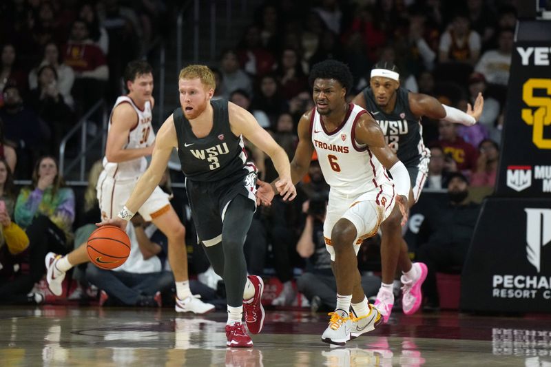 Jan 10, 2024; Los Angeles, California, USA; Washington State Cougars guard Jabe Mullins (3) dribbles the ball against Southern California Trojans guard Bronny James (6) in the first half at Galen Center. Mandatory Credit: Kirby Lee-USA TODAY Sports