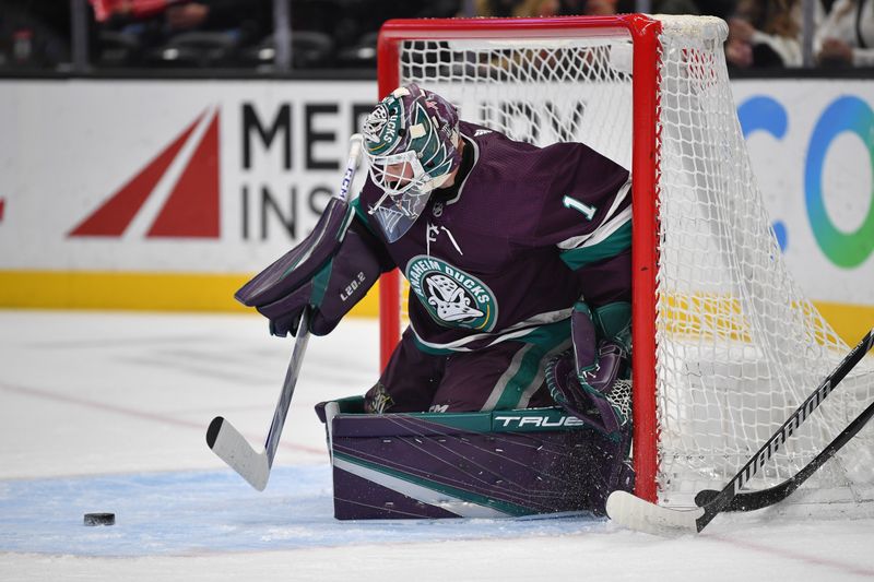 Dec 23, 2023; Anaheim, California, USA; Anaheim Ducks goaltender Lukas Dostal (1) blocks a shot against the Seattle Kraken during the first period at Honda Center. Mandatory Credit: Gary A. Vasquez-USA TODAY Sports