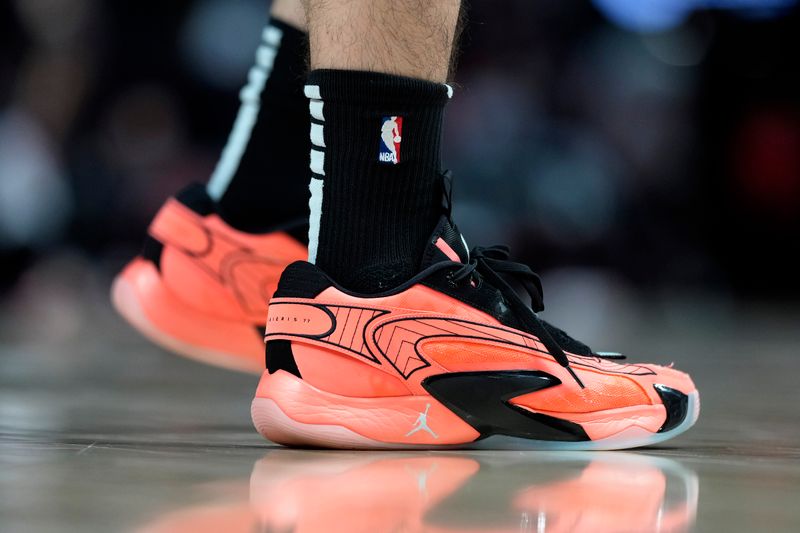 PORTLAND, OREGON - FEBRUARY 27: A general view of the sneakers worn by Jaime Jaquez Jr. #11 of the Miami Heat prior to a game against the Portland Trail Blazers at Moda Center on February 27, 2024 in Portland, Oregon. NOTE TO USER: User expressly acknowledges and agrees that, by downloading and or using this photograph, User is consenting to the terms and conditions of the Getty Images License Agreement. (Photo by Soobum Im/Getty Images)