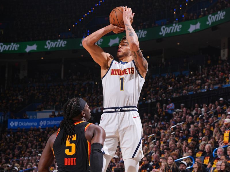 OKLAHOMA CITY, OK - MAY 5: Michael Porter Jr. #1 of the Denver Nuggets shoots a three point basket during the game against the Oklahoma City Thunder during Round Two Game One of the 2025 NBA Playoffs on May 5, 2025 at Paycom Center in Oklahoma City, Oklahoma. NOTE TO USER: User expressly acknowledges and agrees that, by downloading and or using this photograph, User is consenting to the terms and conditions of the Getty Images License Agreement. Mandatory Copyright Notice: Copyright 2025 NBAE (Photo by Garrett Ellwood/NBAE via Getty Images)