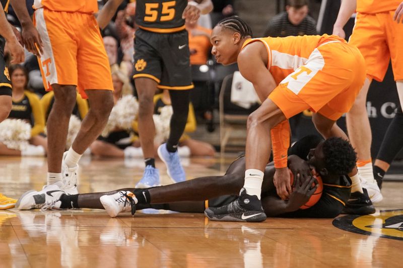 Feb 20, 2024; Columbia, Missouri, USA; Tennessee Volunteers guard Zakai Zeigler (5) and Missouri Tigers center Mabor Majak (45) scramble for the ball during the first half at Mizzou Arena. Mandatory Credit: Denny Medley-USA TODAY Sports