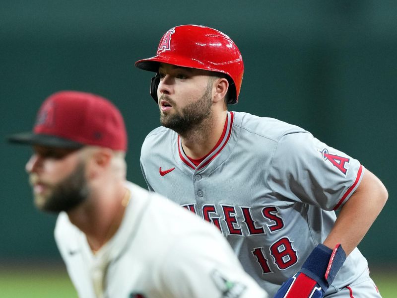 Jun 13, 2024; Phoenix, Arizona, USA; Los Angeles Angels first base Nolan Schanuel (18) leads off first base as Arizona Diamondbacks first base Christian Walker (53) covers the bag during the first inning at Chase Field. Mandatory Credit: Joe Camporeale-USA TODAY Sports