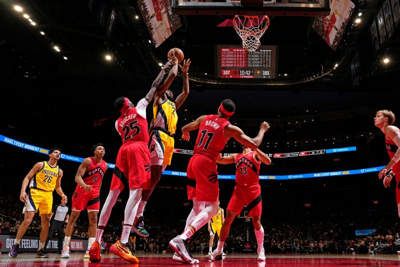 TORONTO, CANADA - FEBRUARY 14: Isaiah Jackson #22 of the Indiana Pacers drives to the basket during the game against the Toronto Raptors on February 14, 2024 at the Scotiabank Arena in Toronto, Ontario, Canada.  NOTE TO USER: User expressly acknowledges and agrees that, by downloading and or using this Photograph, user is consenting to the terms and conditions of the Getty Images License Agreement.  Mandatory Copyright Notice: Copyright 2024 NBAE (Photo by Mark Blinch/NBAE via Getty Images)