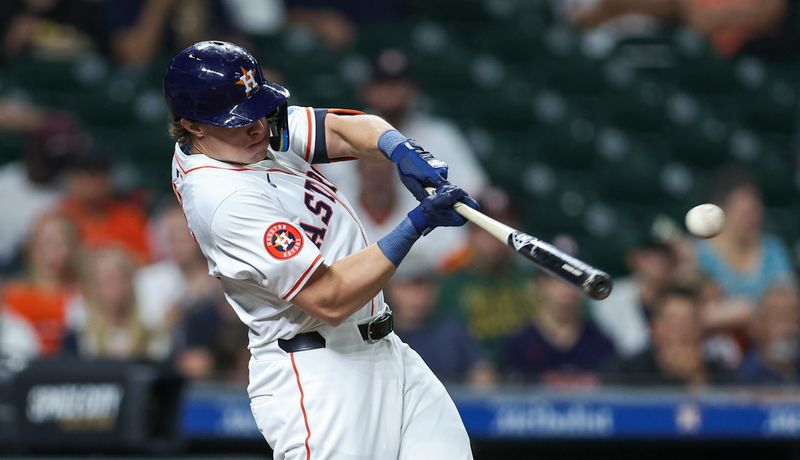 May 16, 2024; Houston, Texas, USA; Houston Astros center fielder Jake Meyers (6) hits a single during the second inning against the Oakland Athletics at Minute Maid Park. Mandatory Credit: Troy Taormina-USA TODAY Sports