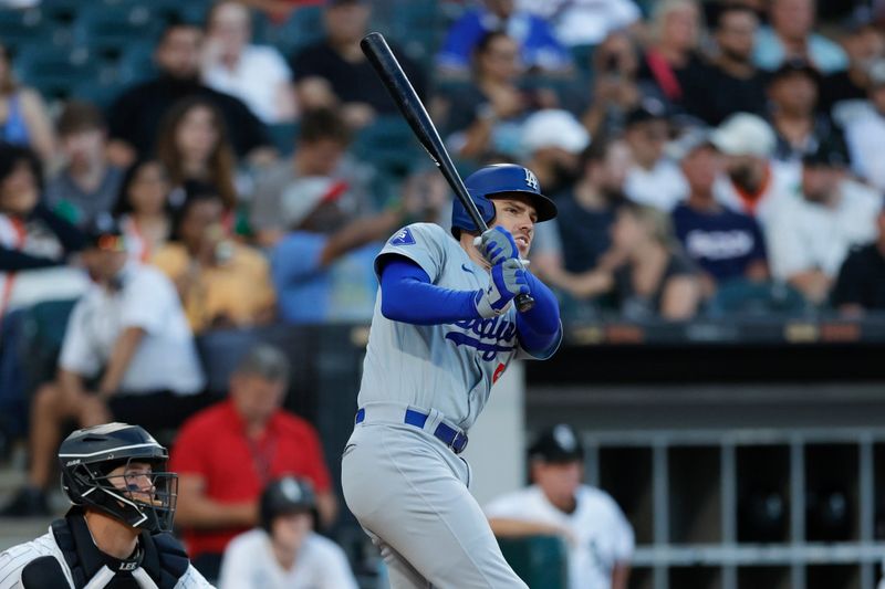 Jun 26, 2024; Chicago, Illinois, USA; Los Angeles Dodgers first baseman Freddie Freeman (5) hits a two-run double against the Chicago White Sox during the third inning at Guaranteed Rate Field. Mandatory Credit: Kamil Krzaczynski-USA TODAY Sports