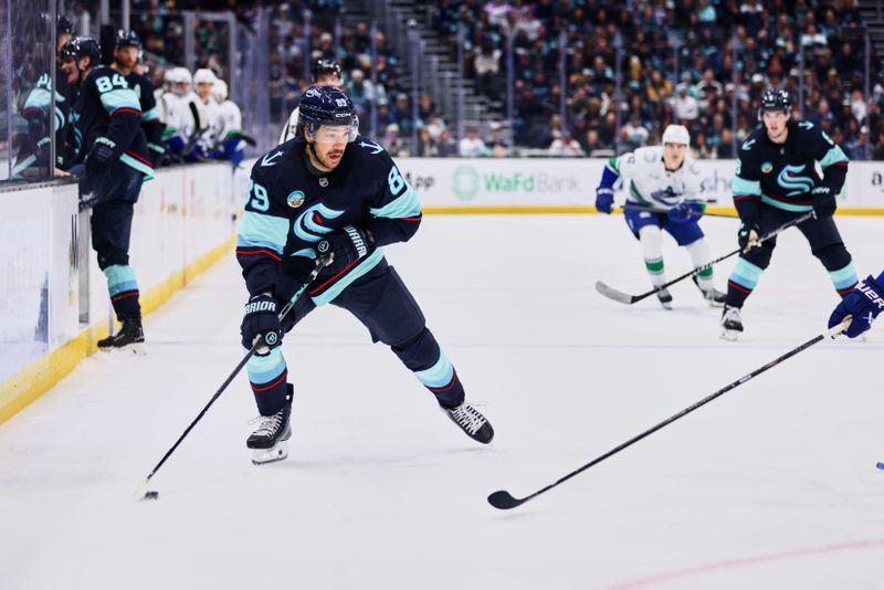 Feb 28, 2026; Seattle, Washington, USA; Seattle Kraken center Frederick Gaudreau (89) looks to pass during the second period Vancouver Canucks at Climate Pledge Arena. Mandatory Credit: Blake Dahlin-Imagn Images