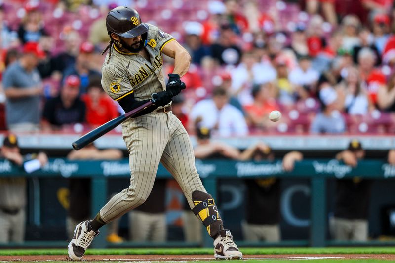 May 21, 2024; Cincinnati, Ohio, USA; San Diego Padres outfielder Fernando Tatis Jr. (23) hits a single against the Cincinnati Reds in the first inning at Great American Ball Park. Mandatory Credit: Katie Stratman-USA TODAY Sports